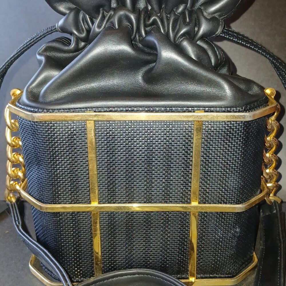 Black drawstring bag in gold cage